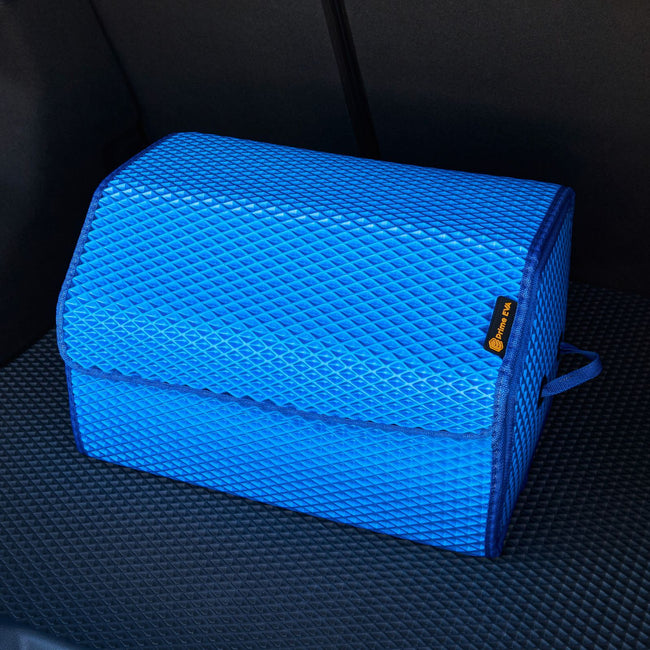 Large blue car trunk organizer on black mat for tidy storage.