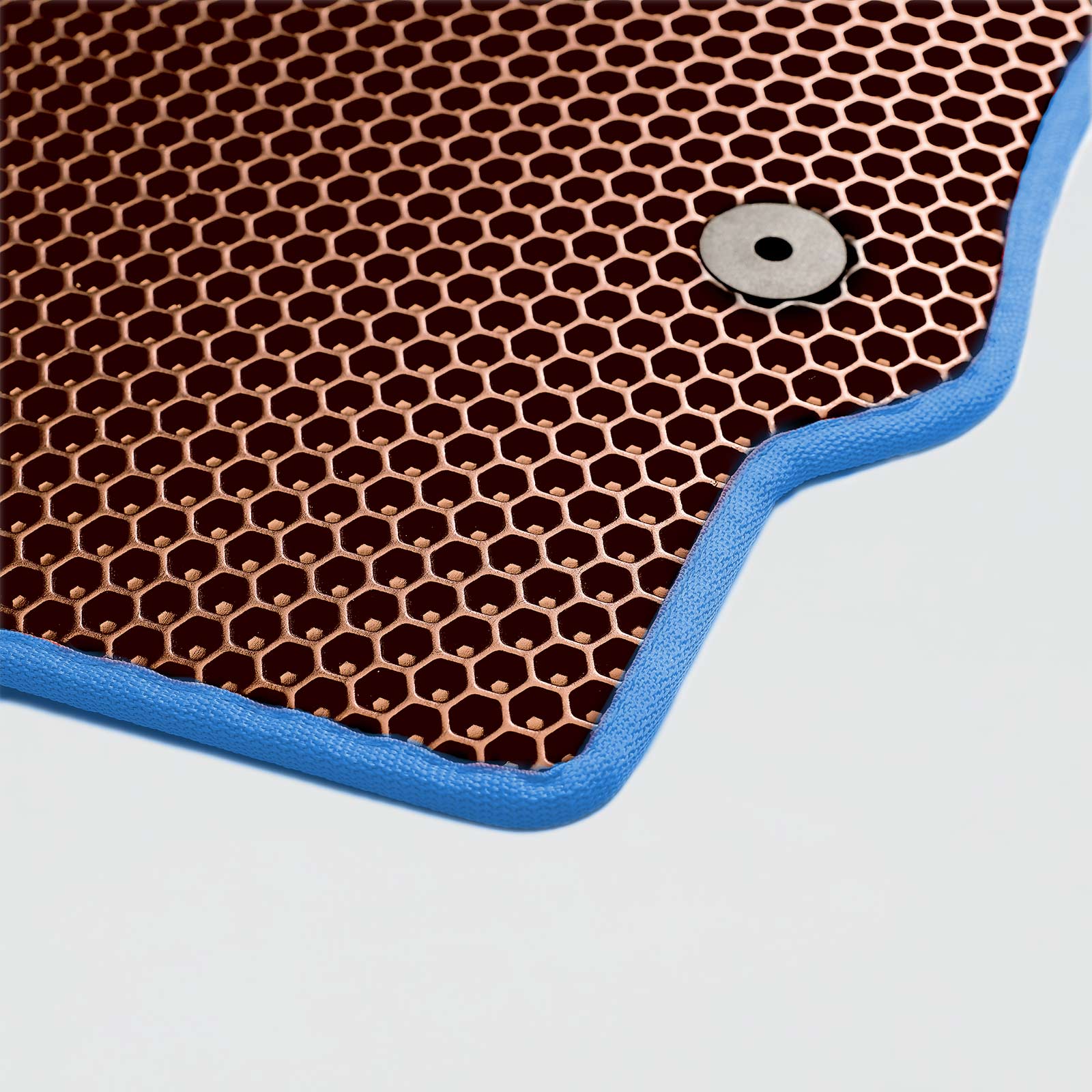 Copper honeycomb mesh mat with blue edges and a circular fastener in the corner