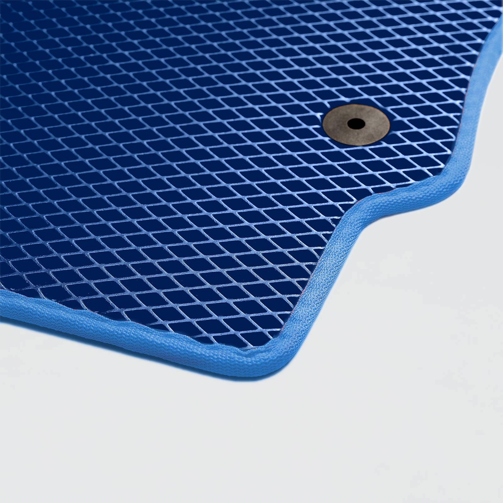 Blue textured mat with a mesh design and a grommet for hanging.