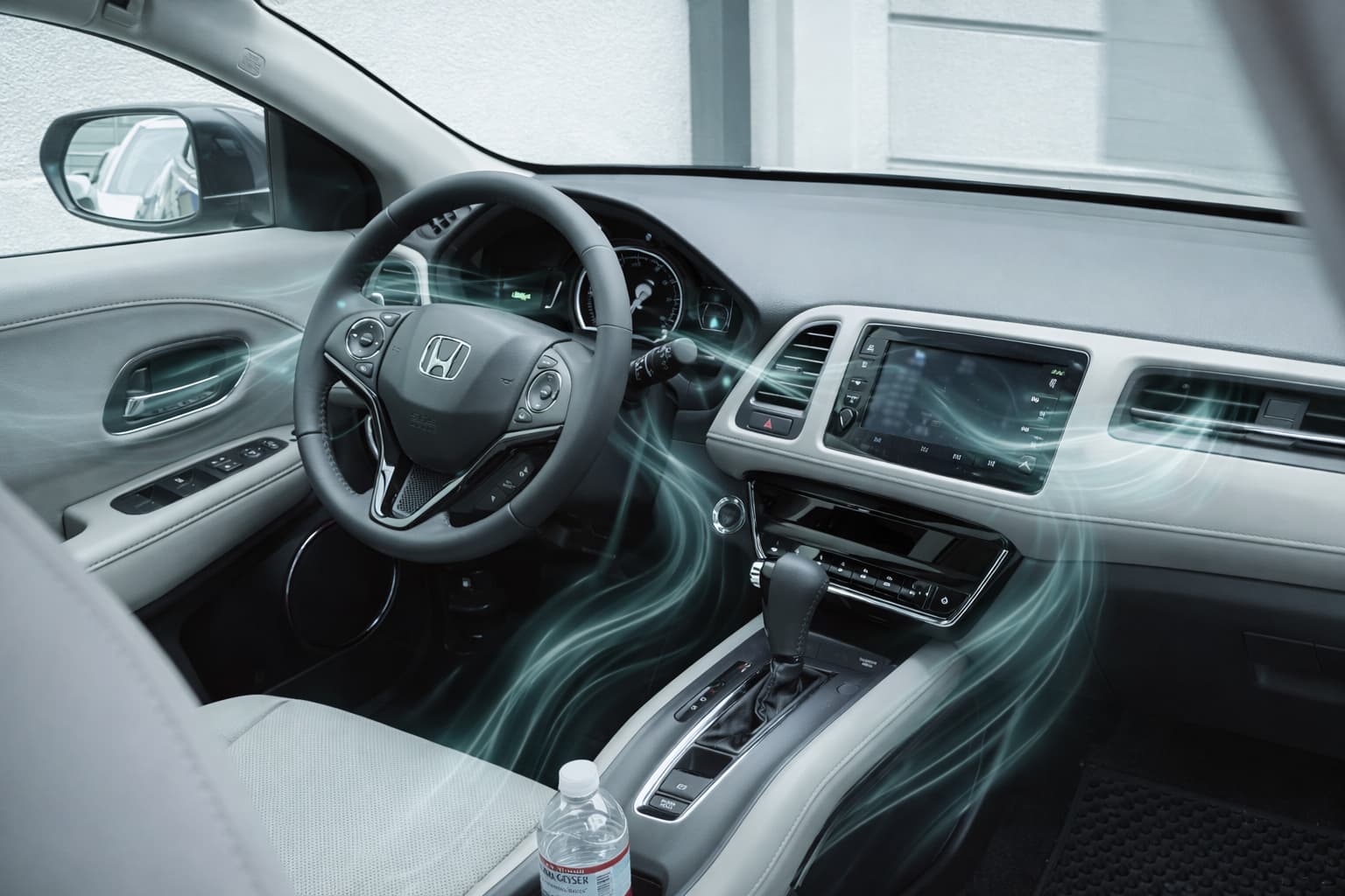 Car interior with dashboard and air vents showing airflow and ventilation system in modern vehicle cabin.