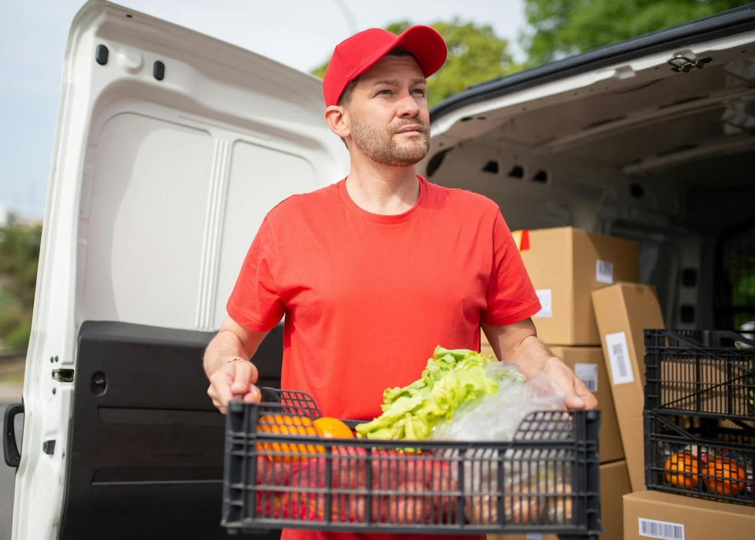 Delivery driver unloading goods from van with EVA trunk mat protecting cargo area from dirt and wear.