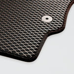 Black mesh mat with a textured surface and a circular hole in one corner.