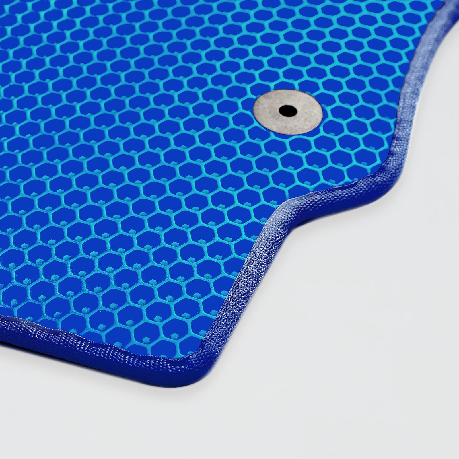 Blue textured mat with hexagonal pattern and a central hole for mounting