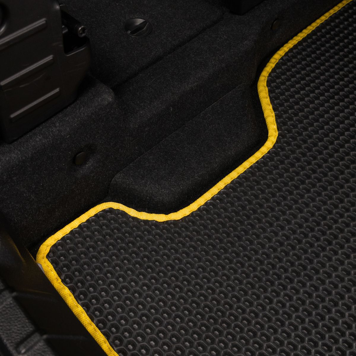 Black and yellow rear cargo mat for BMW, designed for perfect trunk coverage.