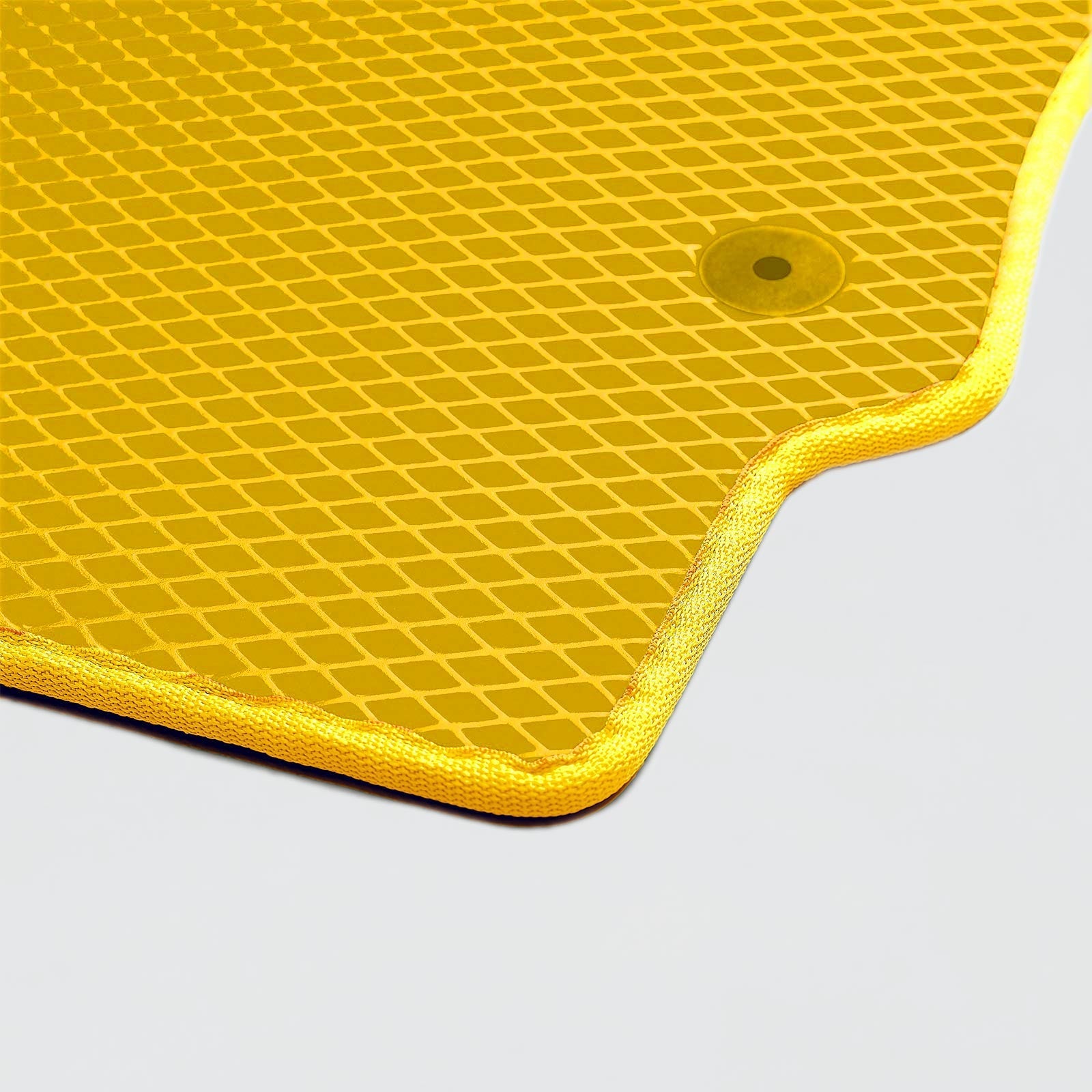 Bright yellow textured mat with a rounded corner and a hole for hanging.