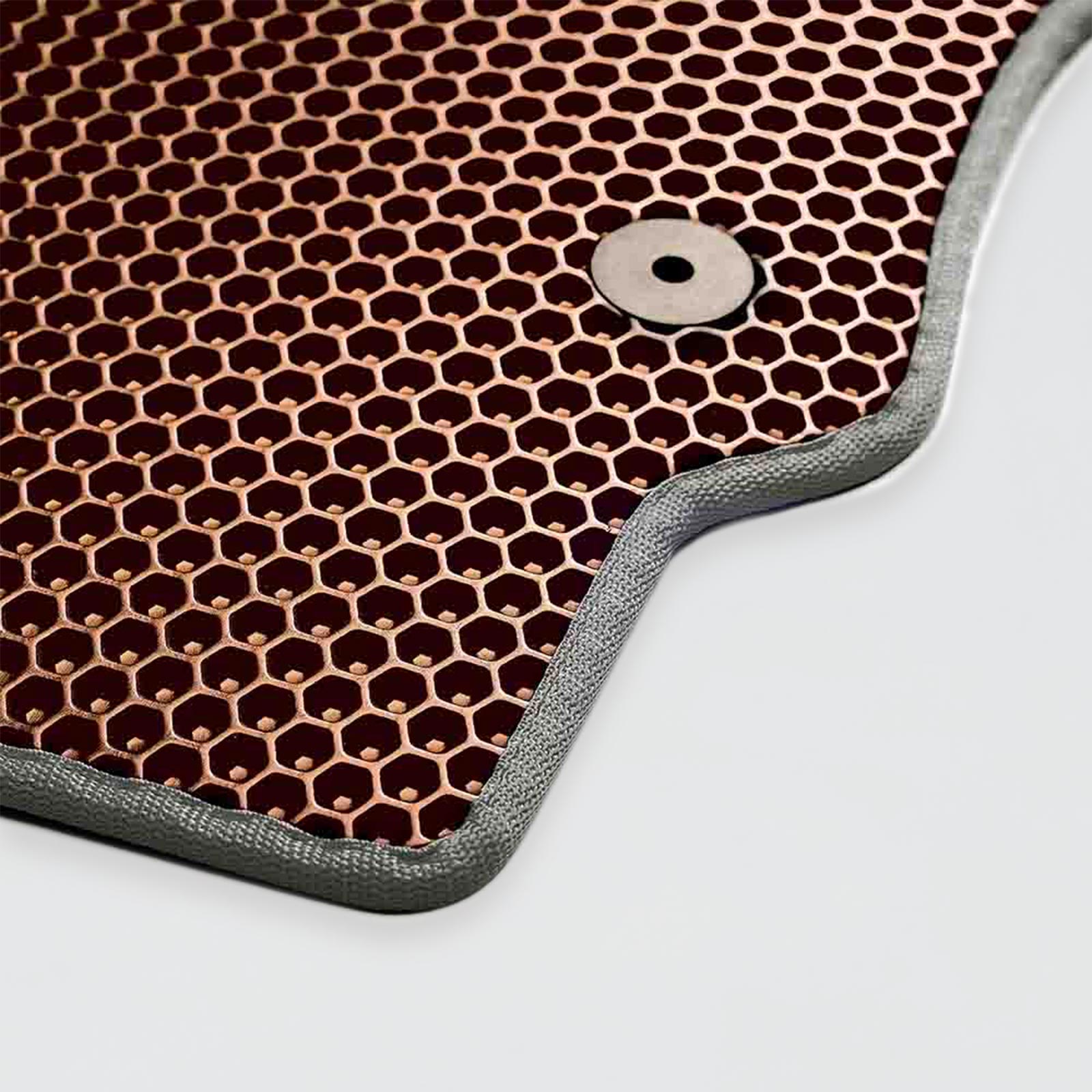 Copper hexagonal patterned surface with a metal fastening rivet.
