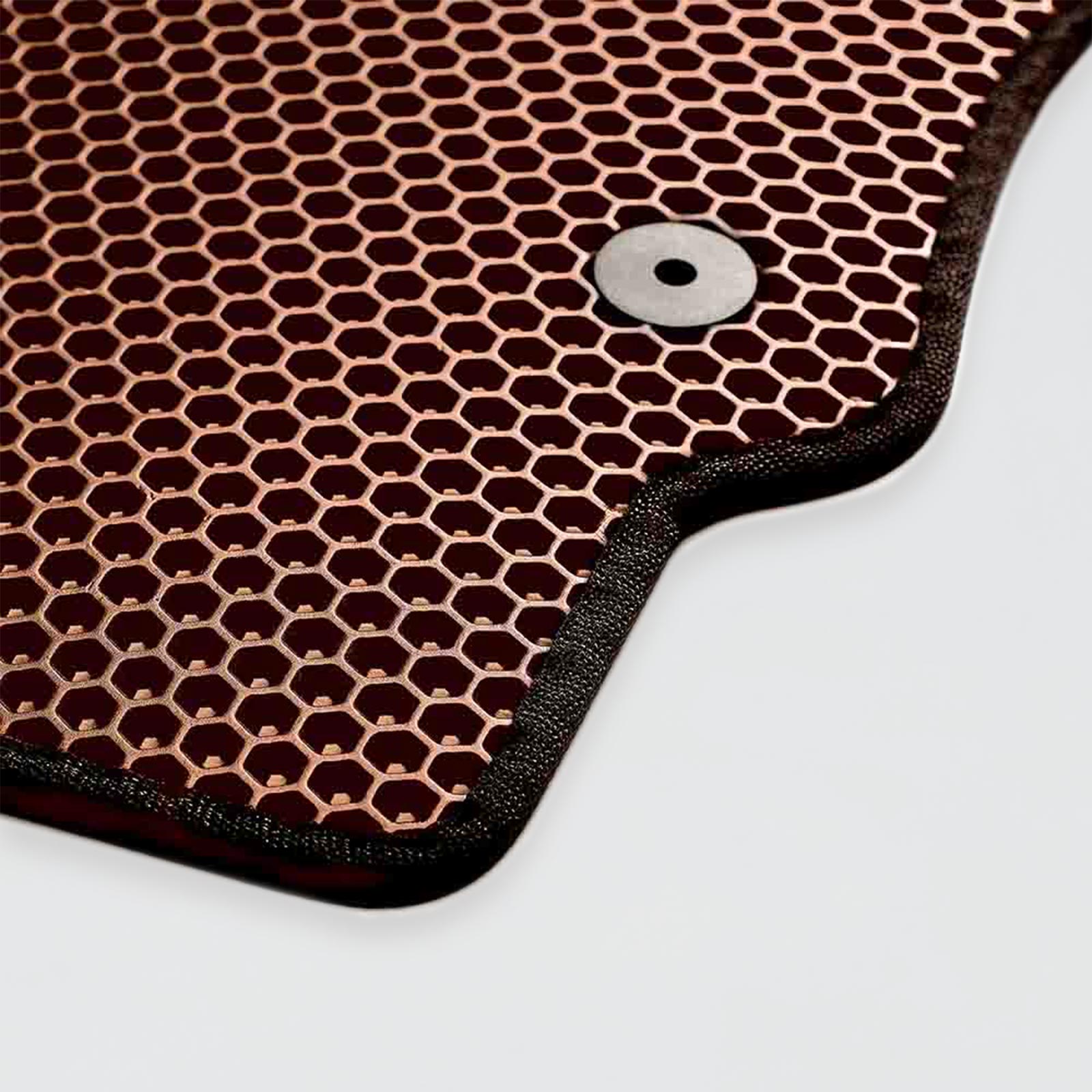Copper honeycomb texture with a metal button on a black border.