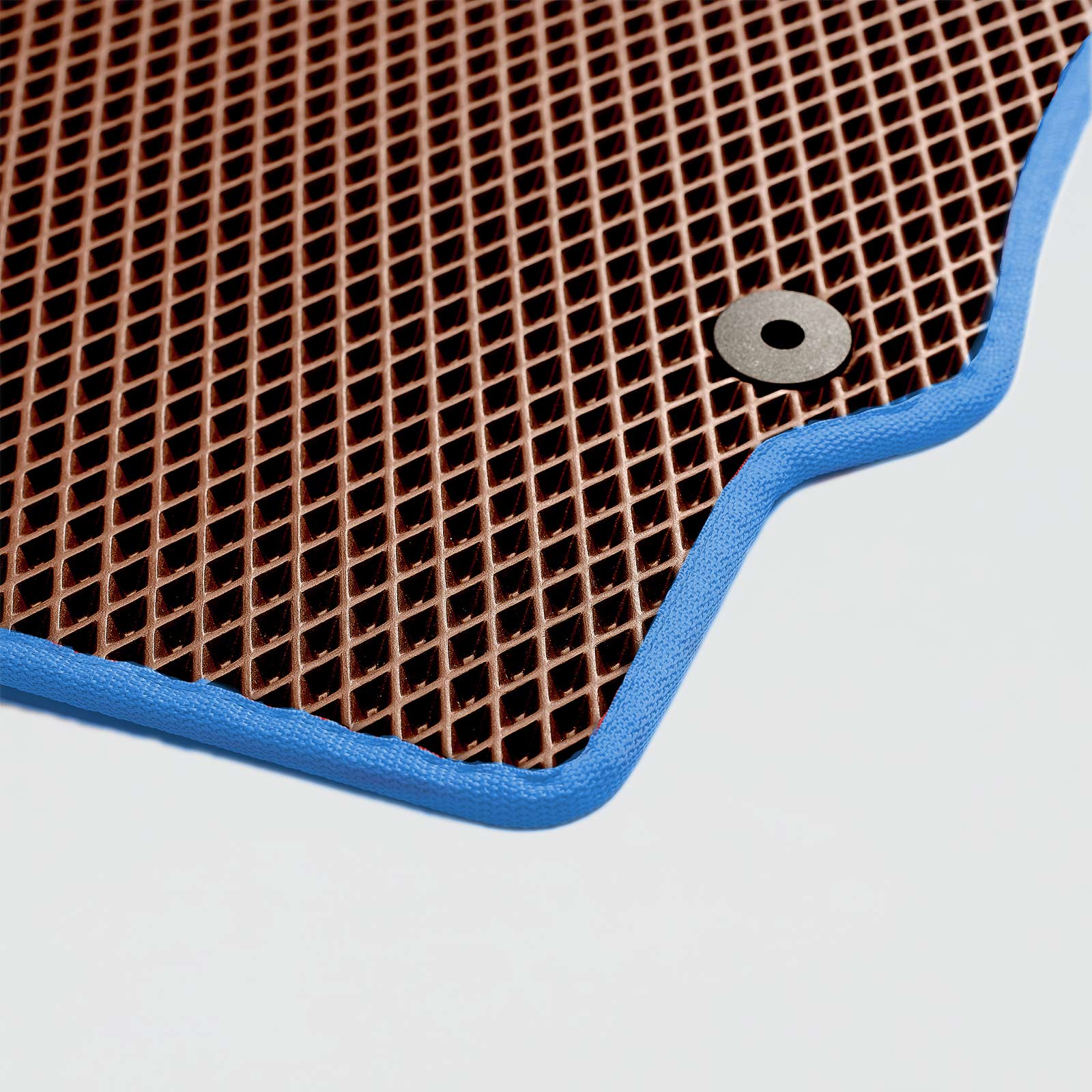 Brown textured surface with blue border and circular grommet detail.