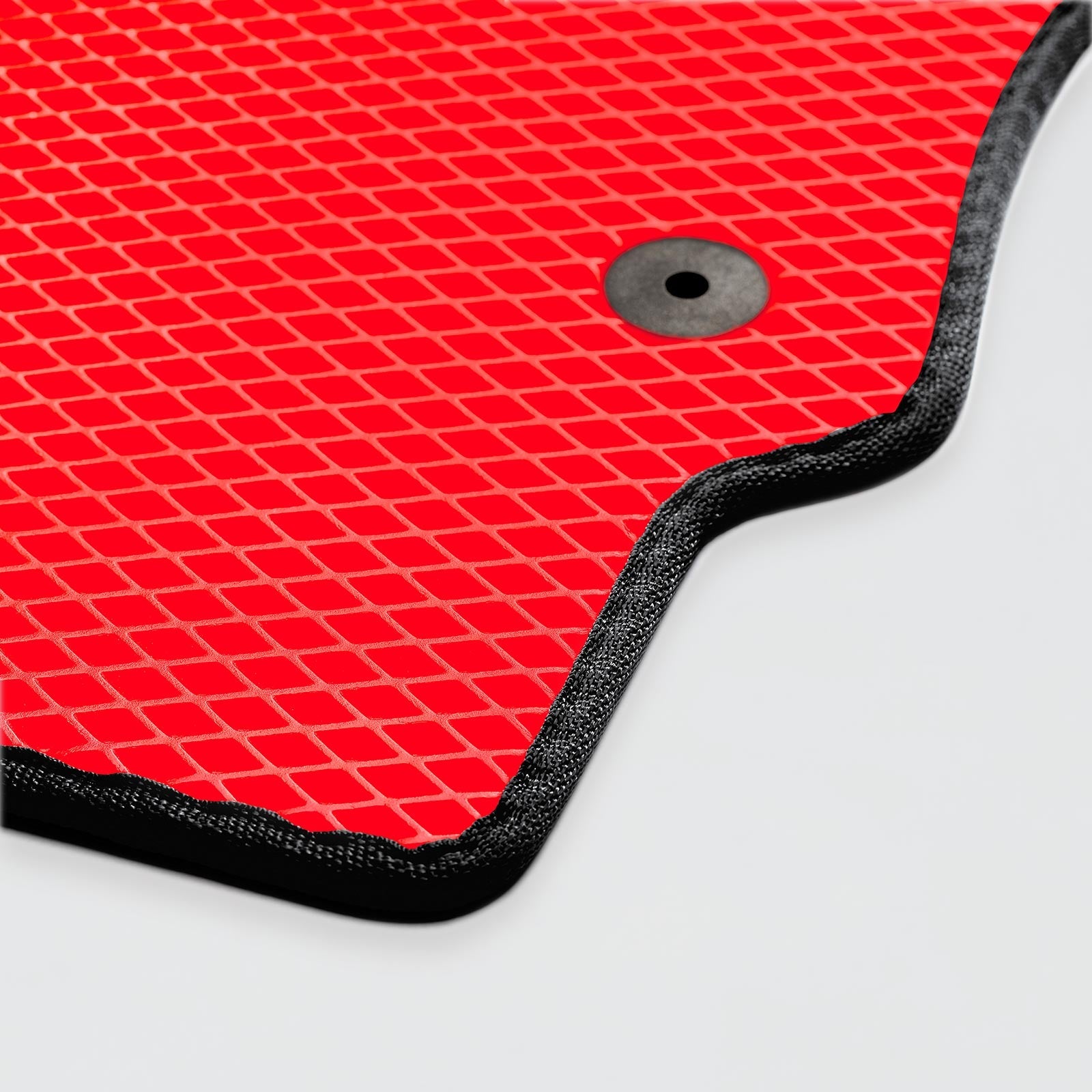 Red textured mat with a black border and a central hole for drainage.