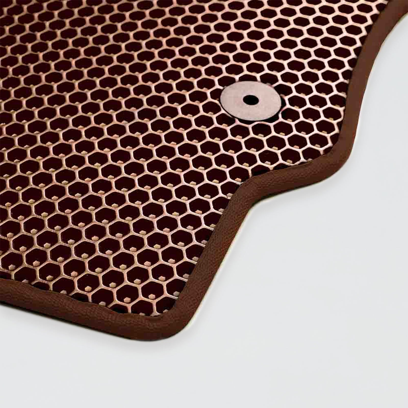 Brown hexagon-patterned rubber mat with a central hole for drainage