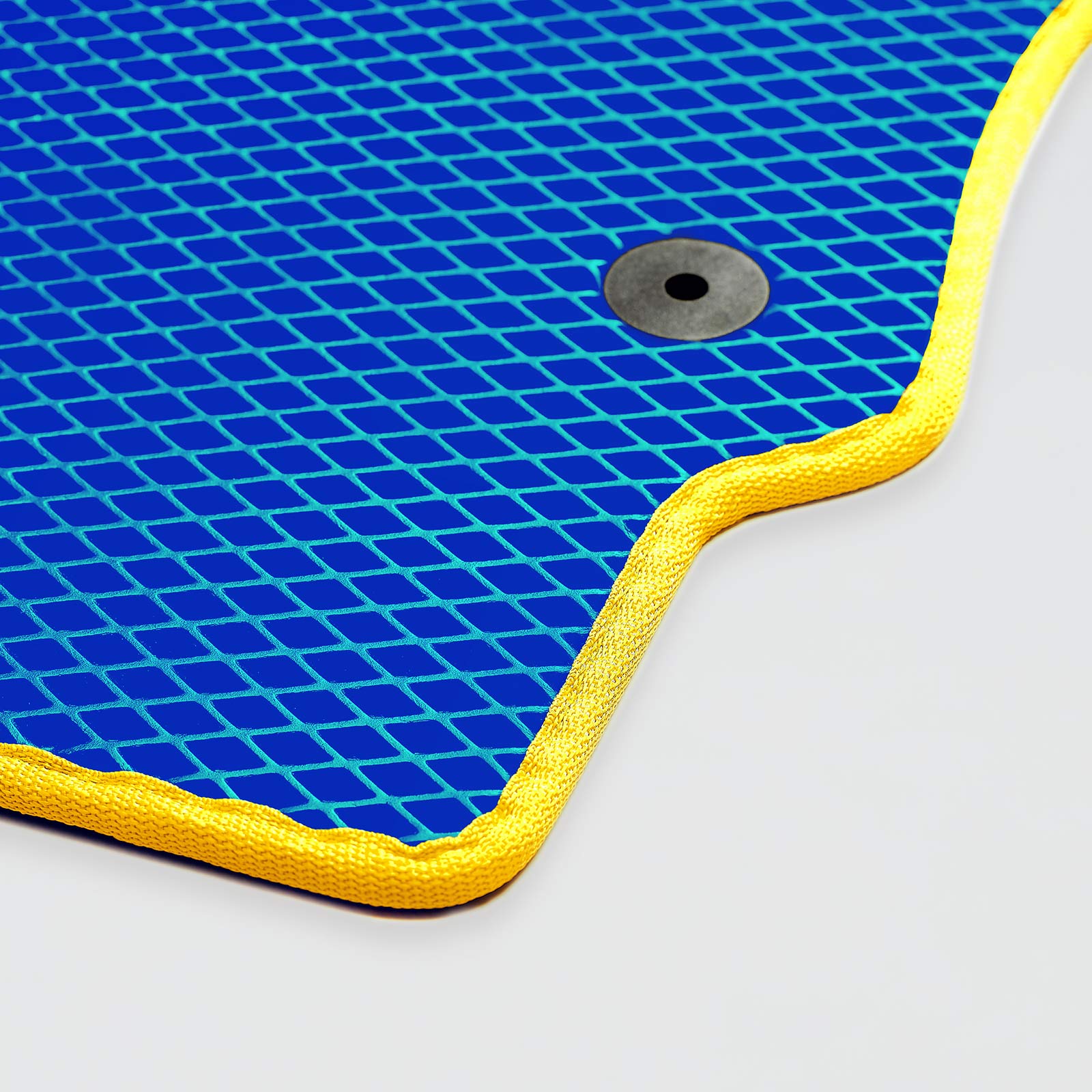 Blue mat with a grid pattern and yellow trim, featuring a metal eyelet.