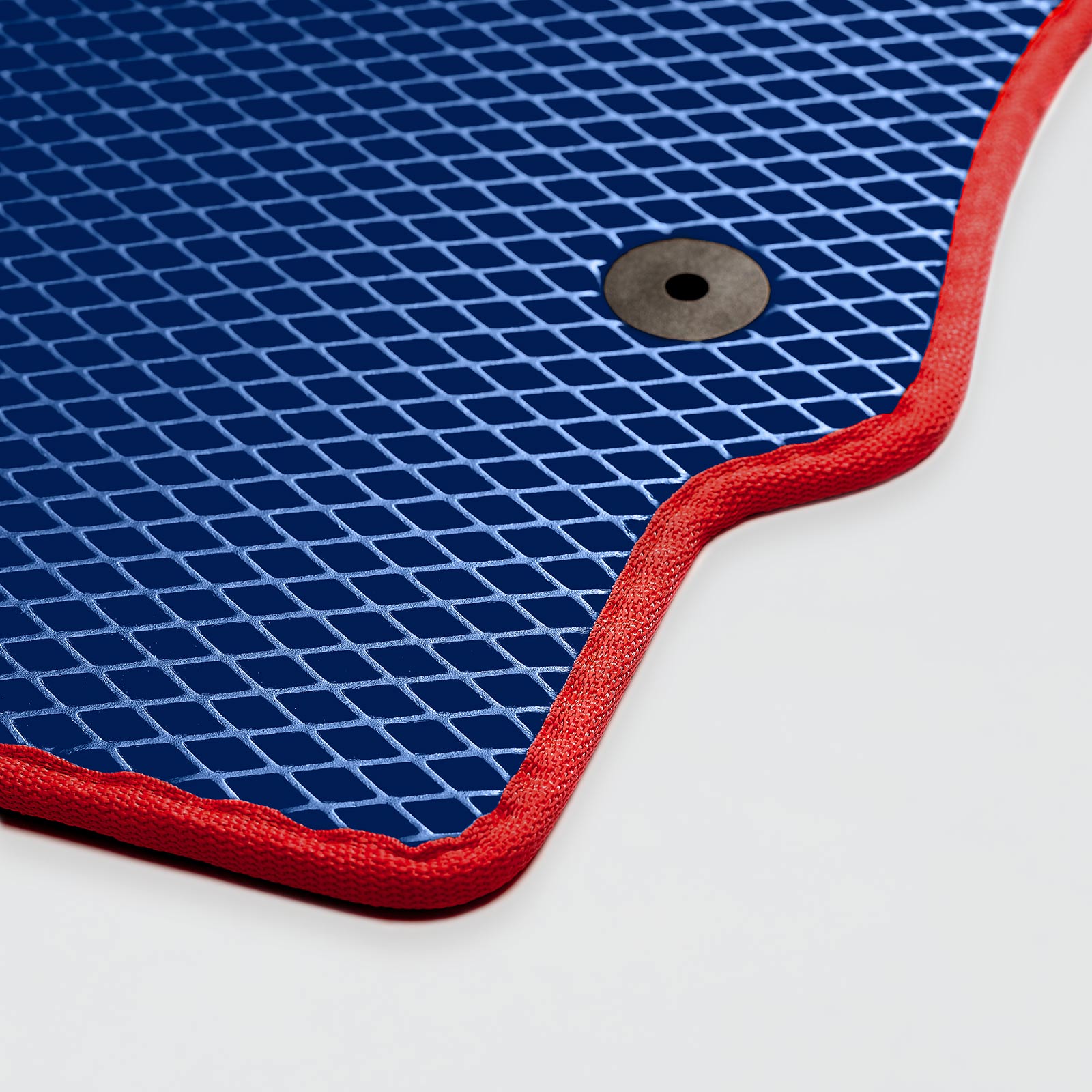 Blue textured surface with red edging and a circular hole in the corner