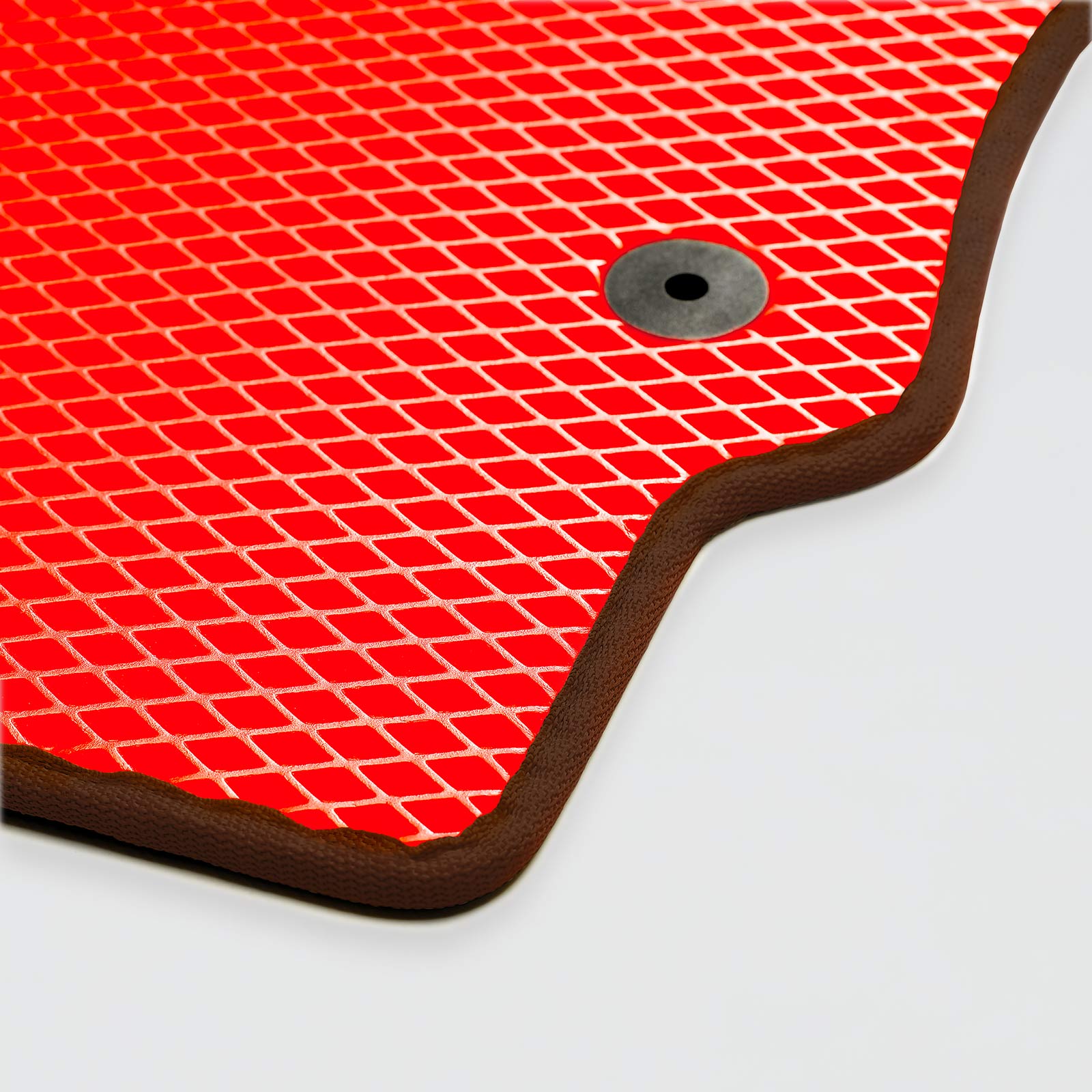 Red textured mat with a circular hole on a light background