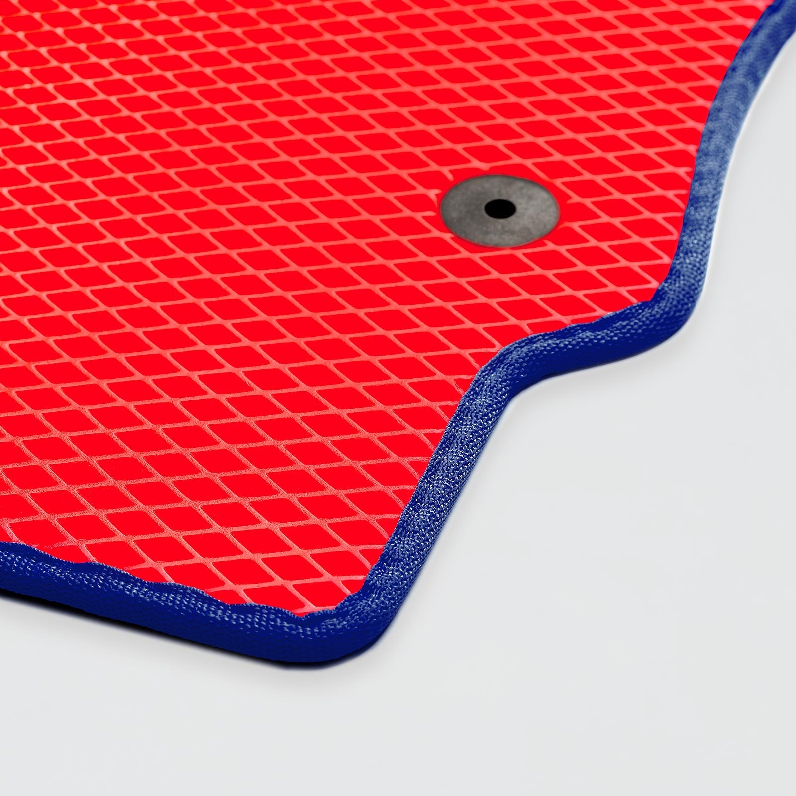 Red textured mat with a blue border and a hole for drainage