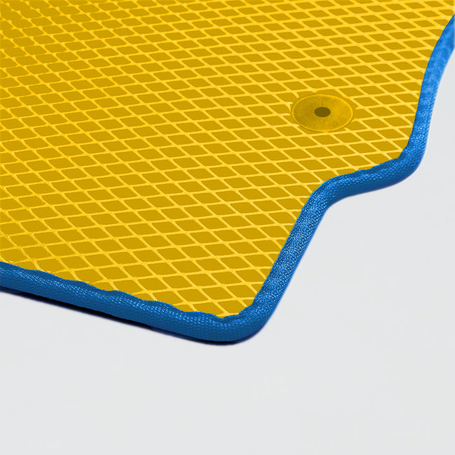 Yellow textured mat with blue edges and a circular hole, suitable for various activities.