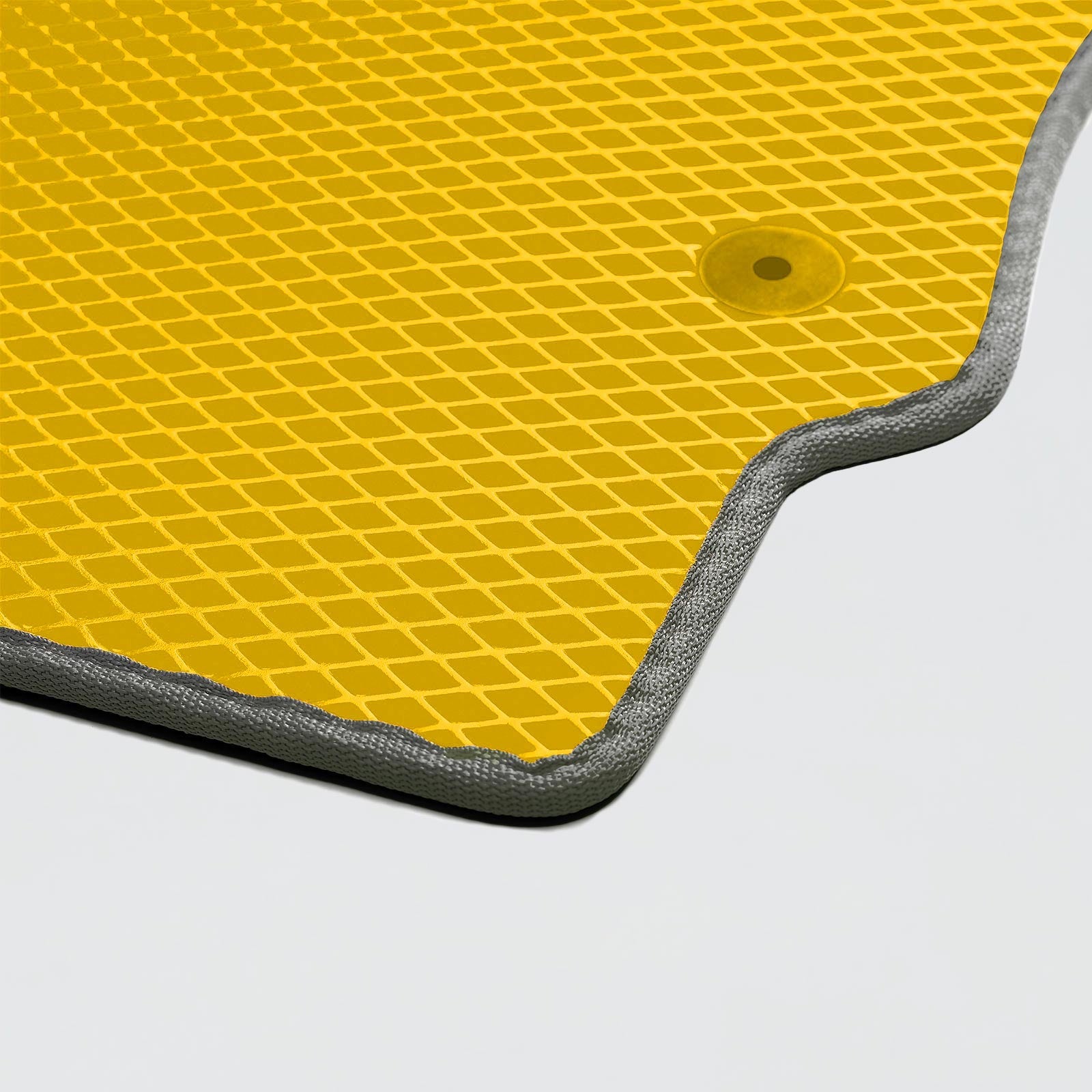 Yellow textured mat with gray edging, featuring a circular hole for easy hanging or fastening.